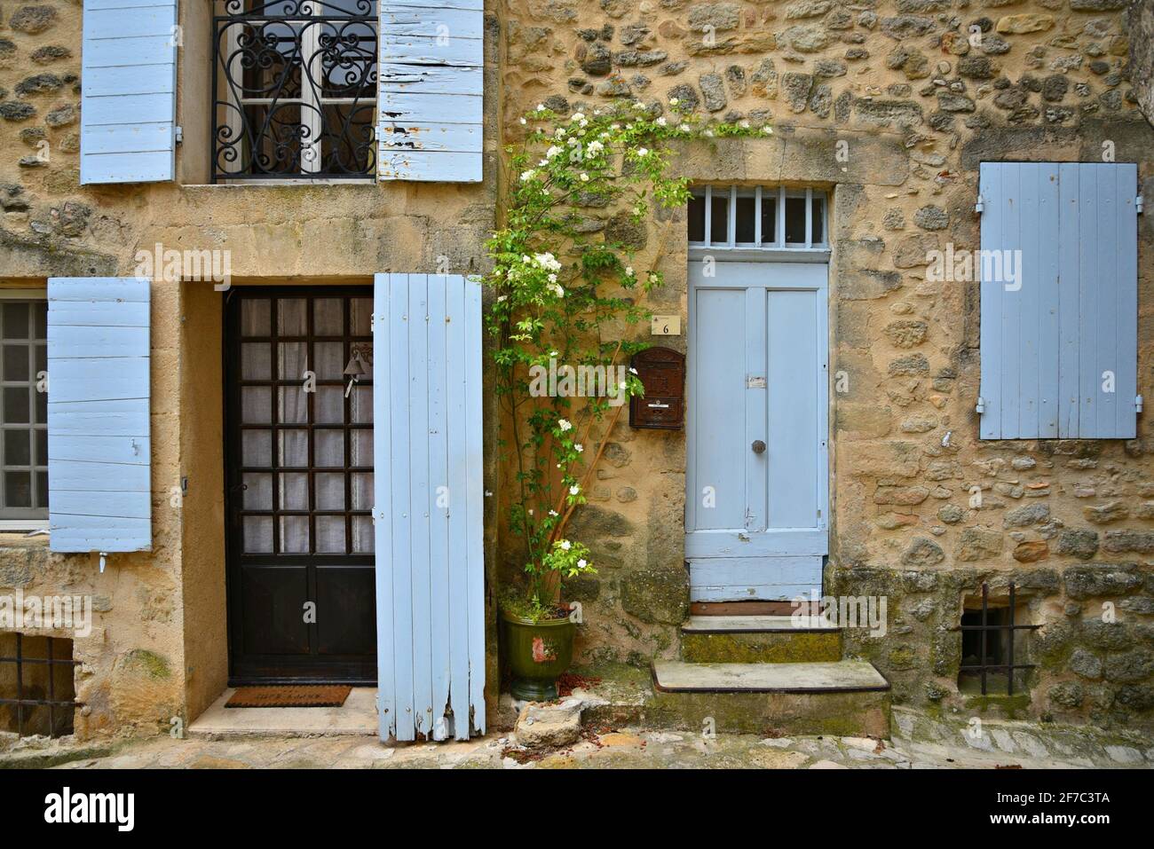 Rural Provençal style house stone facade in the picturesque village of Grambois, Provence-Alpes-Côte d'Azur, Vaucluse, France. Stock Photo