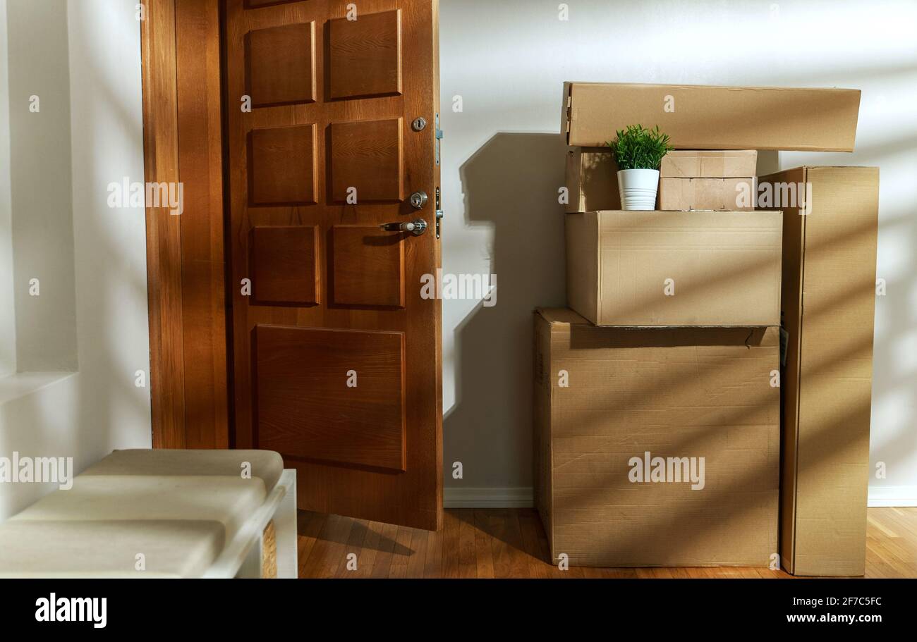 New home concept. Boxes in empty room near the entrance door Stock ...