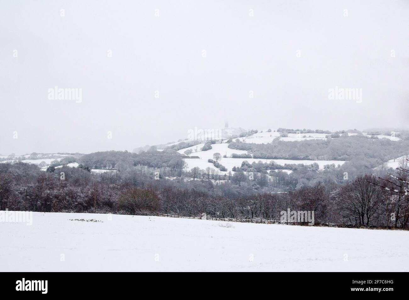 Honley Castle Hill seen from Honley Village in the snow Stock Photo - Alamy
