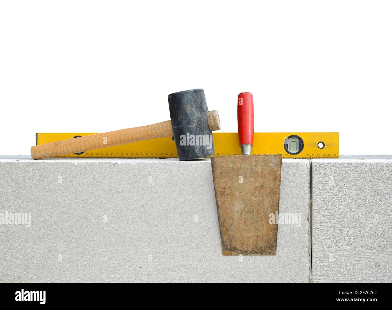 Masonry tools on white wall. Bricklaying work Stock Photo Alamy