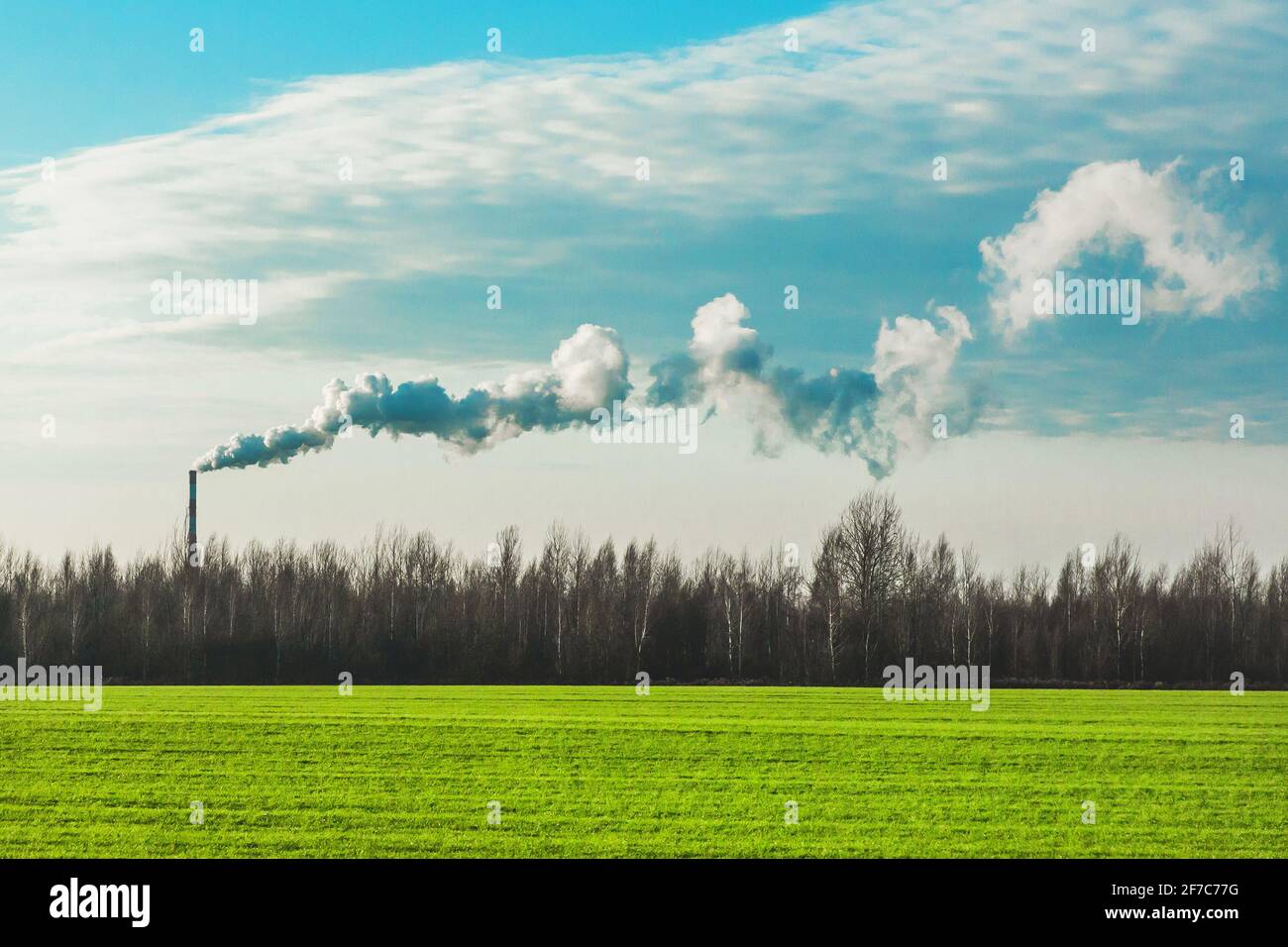 Environmental pollution, environmental problems, smoke from the chimney of an industrial plant or thermal power plant. Stock Photo