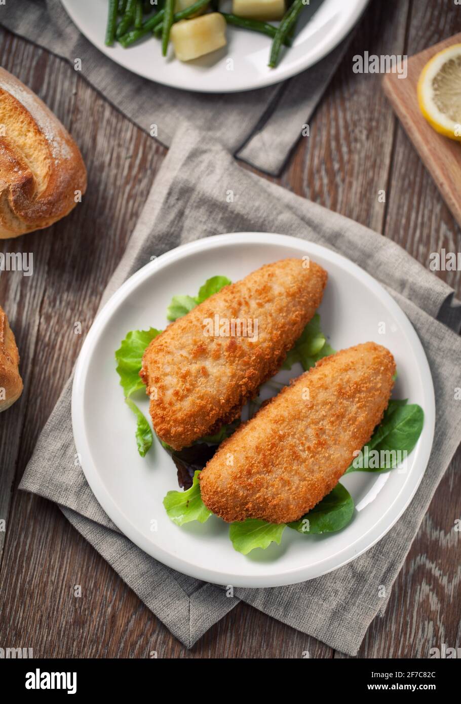 Breaded Fish Fillet With Salad. High quality photo. Stock Photo