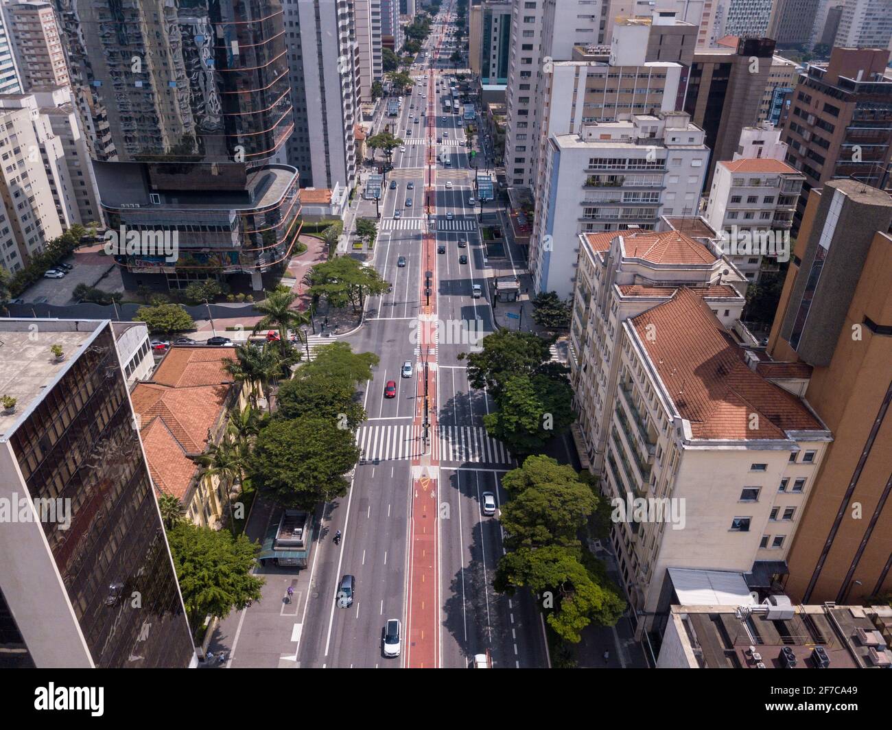 Beautiful aerial top view of bike path and buildings on Avenida Paulista street, São Paulo city skyline in sunny summer day. Brazil urban cityscape. Stock Photo