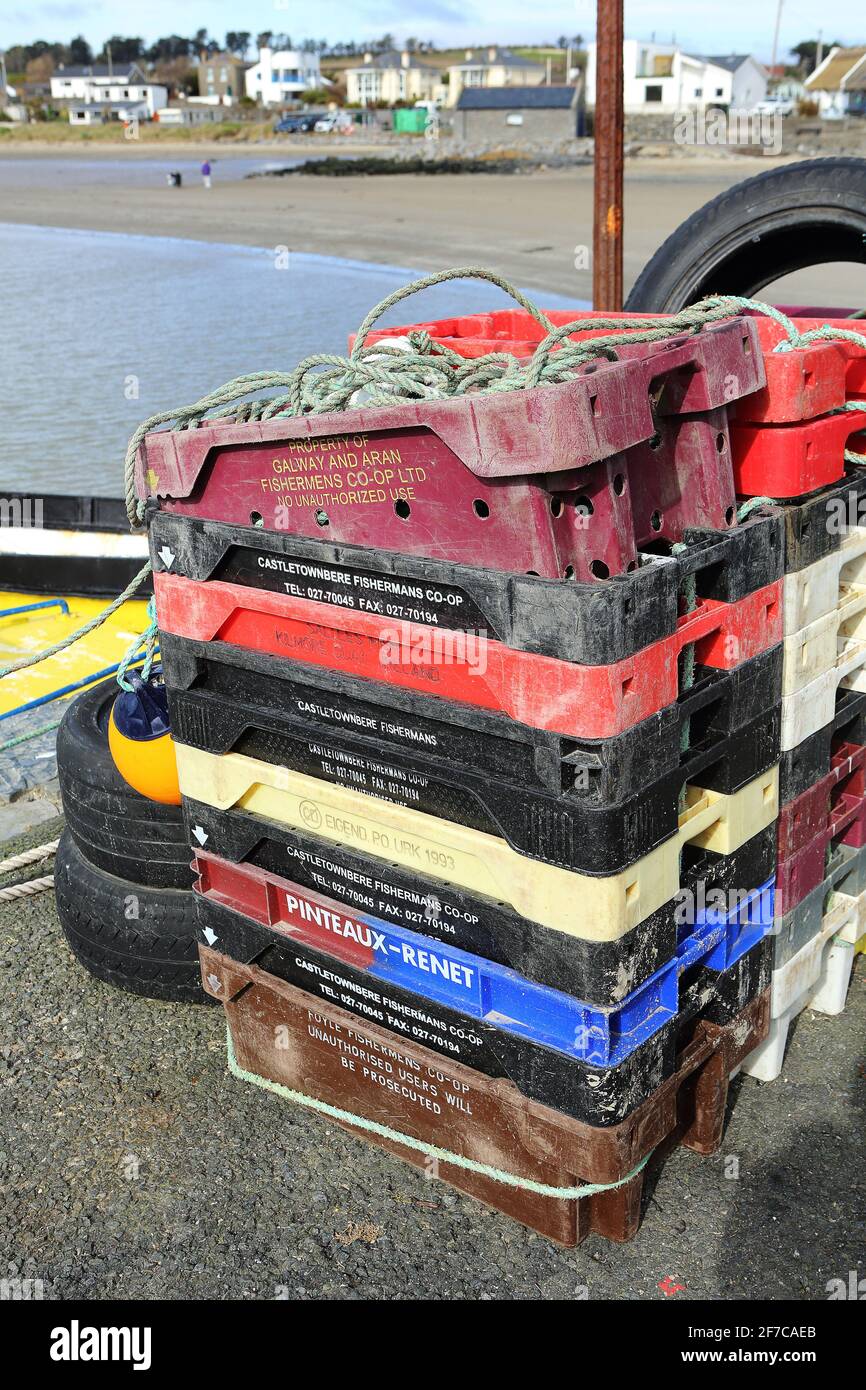 Fish crates on the quayside in Loughshinny harbour, Ireland Stock Photo