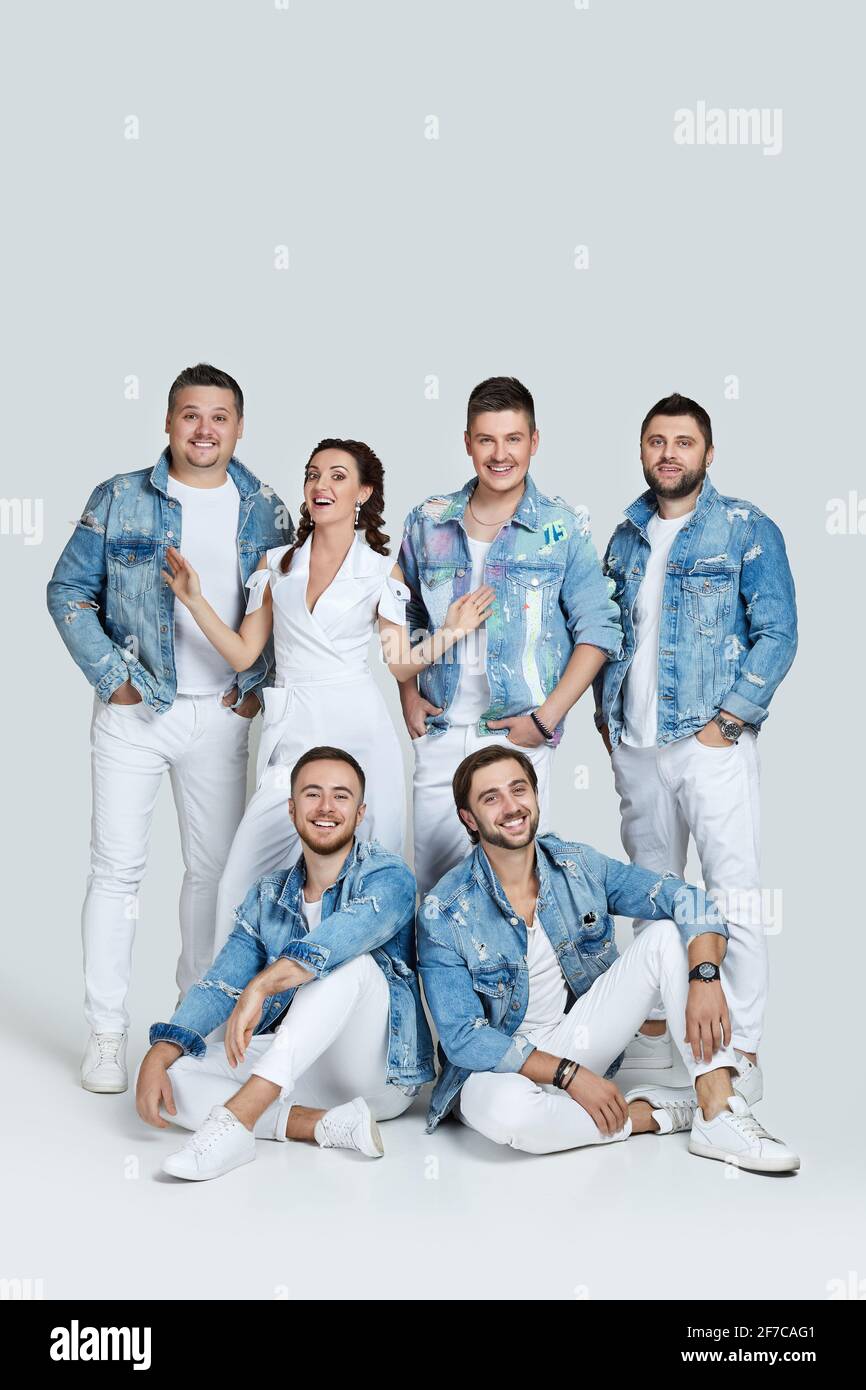 happy men and woman in denim t-shirt jeans on studio background Stock Photo  - Alamy