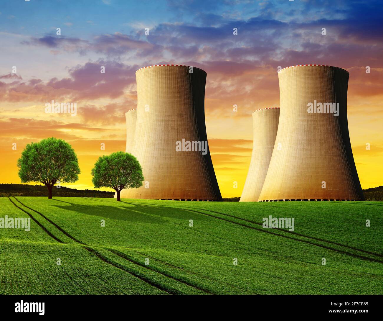 Cooling towers of a nuclear power plant in the sunset Stock Photo - Alamy