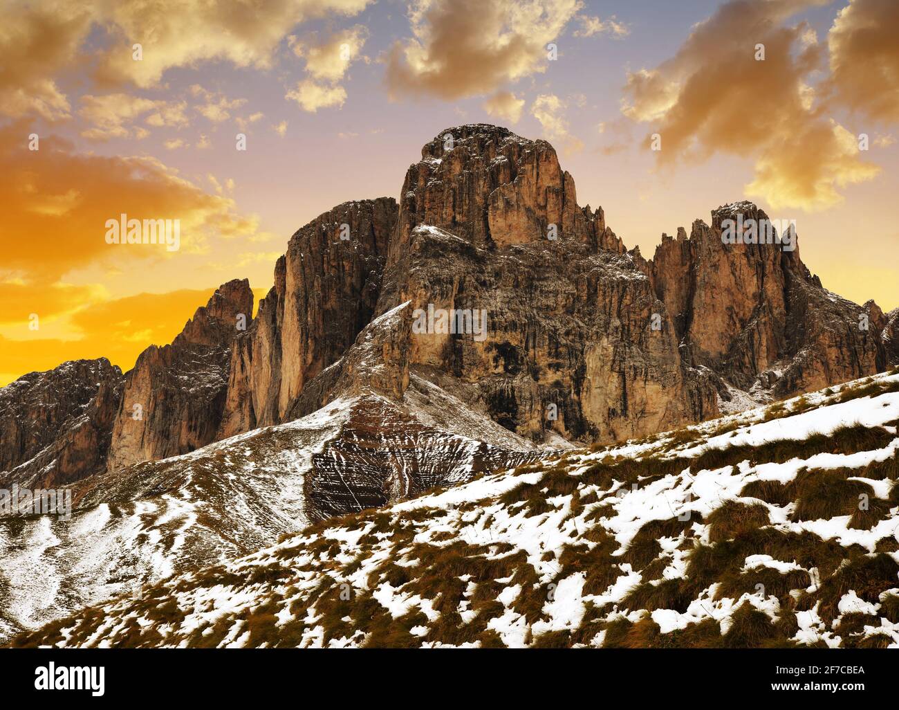 Mountain group Sassolungo (Langkofel) at sunset. Beautiful snowy winter landscape in Dolomites. Province of Trento, South Tyrol, Italy. Stock Photo