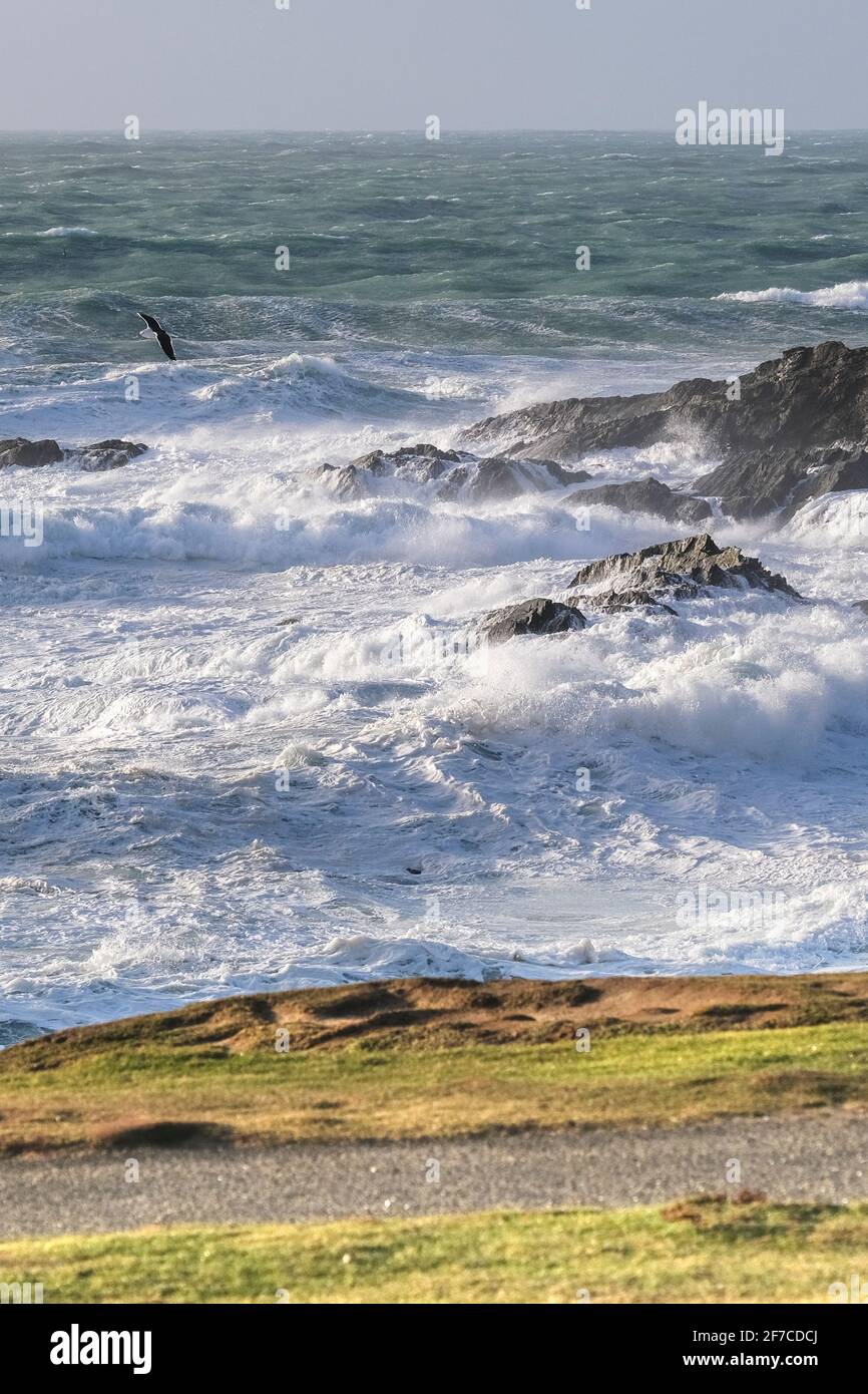 Stormy sea with wild waves breaking over the rocks at Little Fistral at Towan Head in Newquay in Cornwall. Stock Photo
