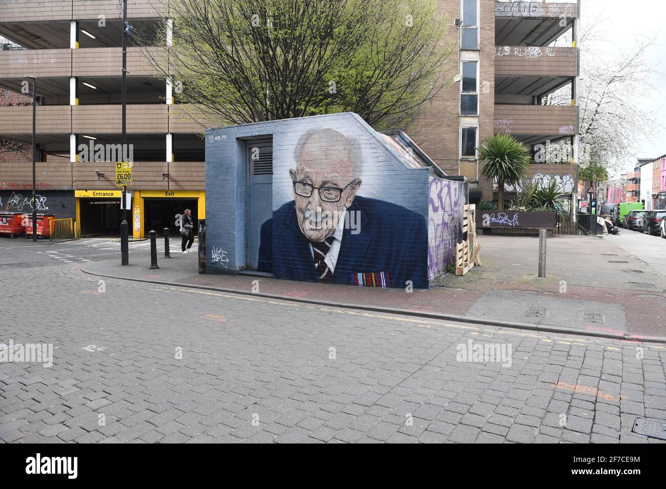 Sir Captain Tom Moore Mural Manchester  - local street artist Akse-P19 has painted the Mural  on the corner of Tib Street and Thomas Street,  Captain Stock Photo