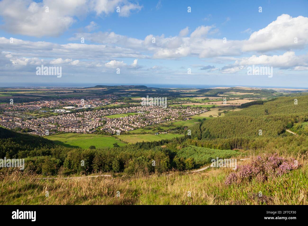 Sunny summer view over the town of Guisborough and the surrounding countryside taken from the hills of Guisborough Moor Stock Photo