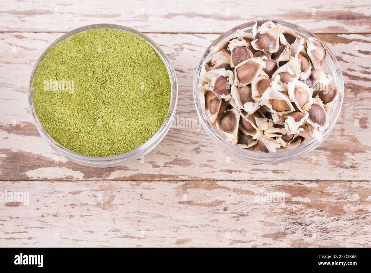 Moringa seeds and powder on wooden background - Moringa oleifera Stock ...