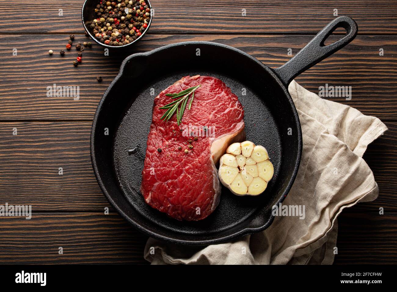 Raw beef steak on frying pan from above Stock Photo Alamy