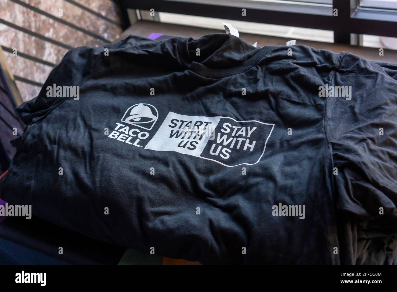 New York, USA. 23rd Apr, 2019. Branded tee-shirt in the Taco Bell Cantina restaurant in Midtown Manhattan in New York on Tuesday, April 23, 2019 during one of their 600 Hiring Parties they are hosting. The restaurant chain announced another job fair for April 21, 2021 where they will fill at least 5000 jobs. (Photo by Richard B. Levine) Credit: Sipa USA/Alamy Live News Stock Photo