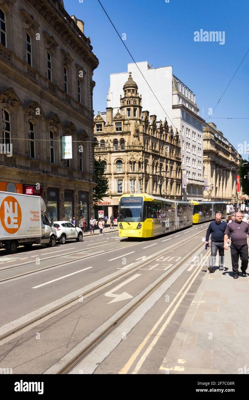 Cross Street, Manchester, looking north towards St. Ann Street with a passing northbound tram. Stock Photo