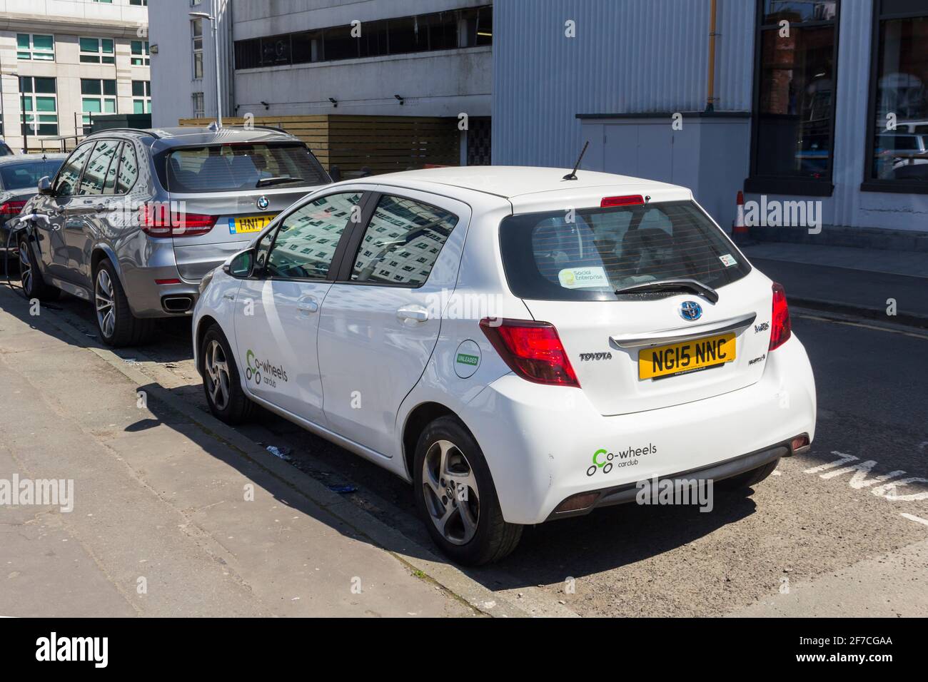 Toyota Yaris hybrid car operated by Co-Wheels car club  in one of their reserved parking spaces on Browncross Street in Salford, Greater Manchester. Stock Photo