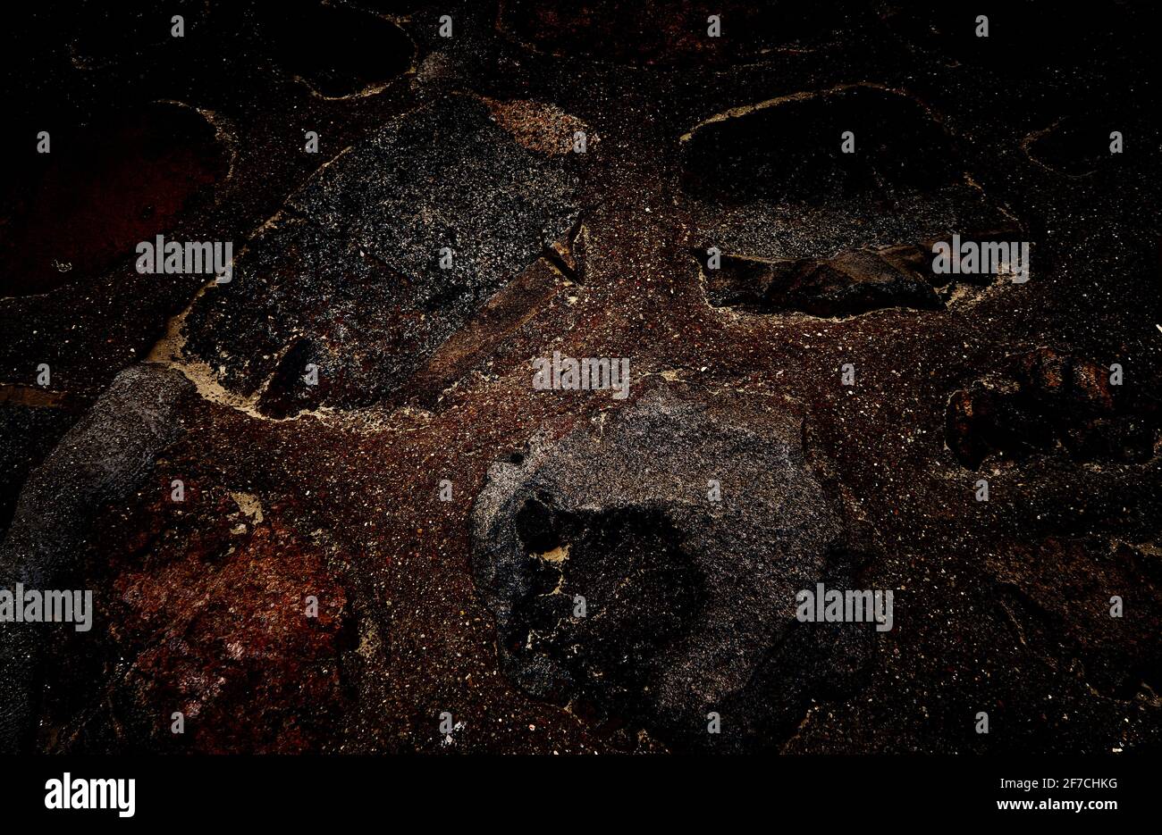 Black texture with light inclusions as a background. Stock Photo