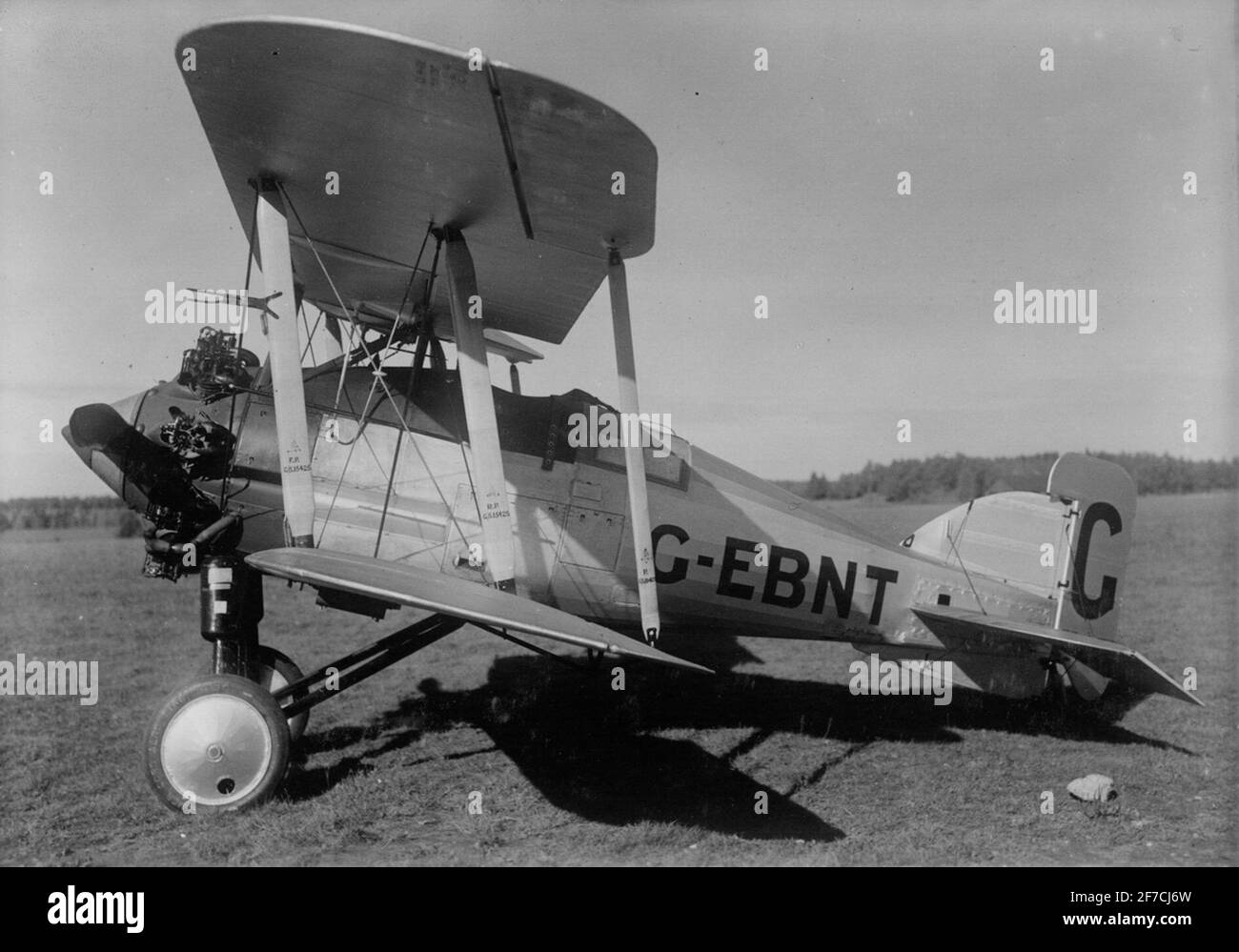 Gloster Gamecock on an airfield, about 1925 motif: British airplane Gloster Gamecock with registration G-EBNT on an airfield around 1925. View from the side. Stock Photo