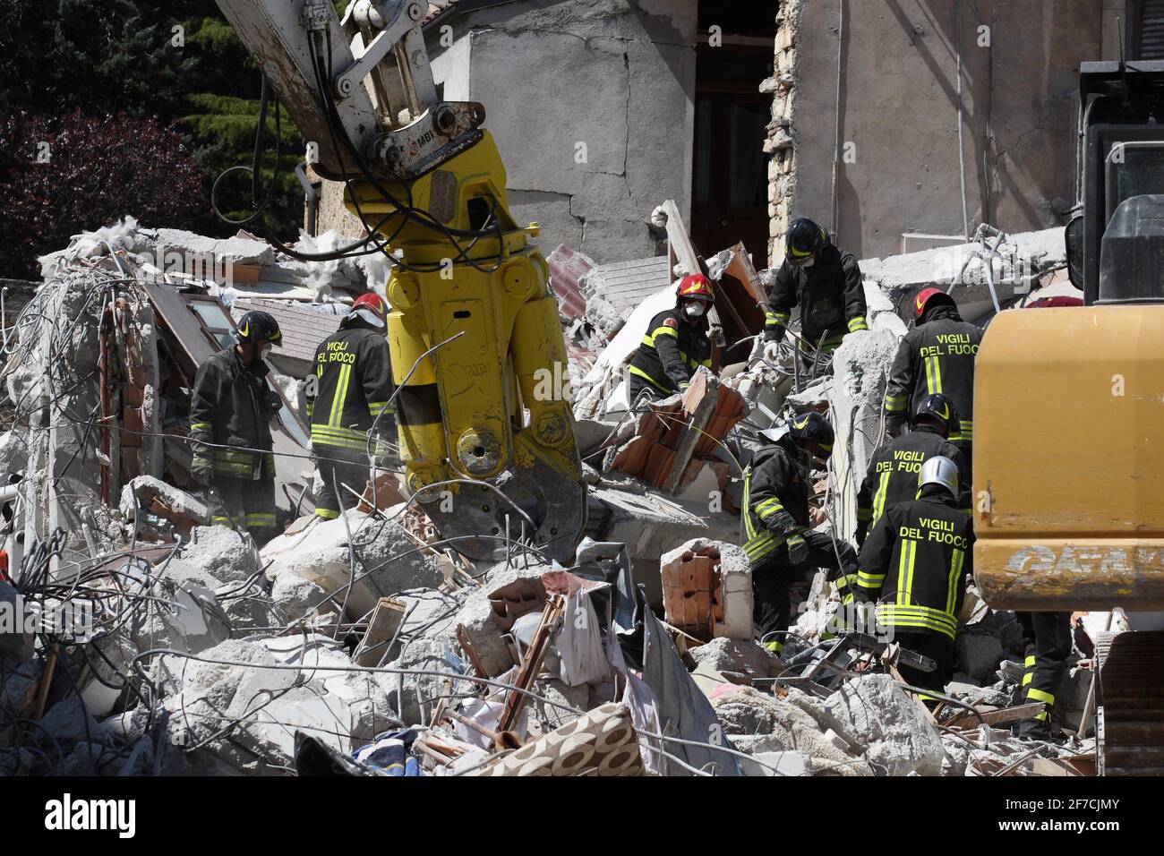 L'Aquila, Italy - April 6, 2009: Rescuers at work in the rubble of the city destroyed by the earthquake Stock Photo