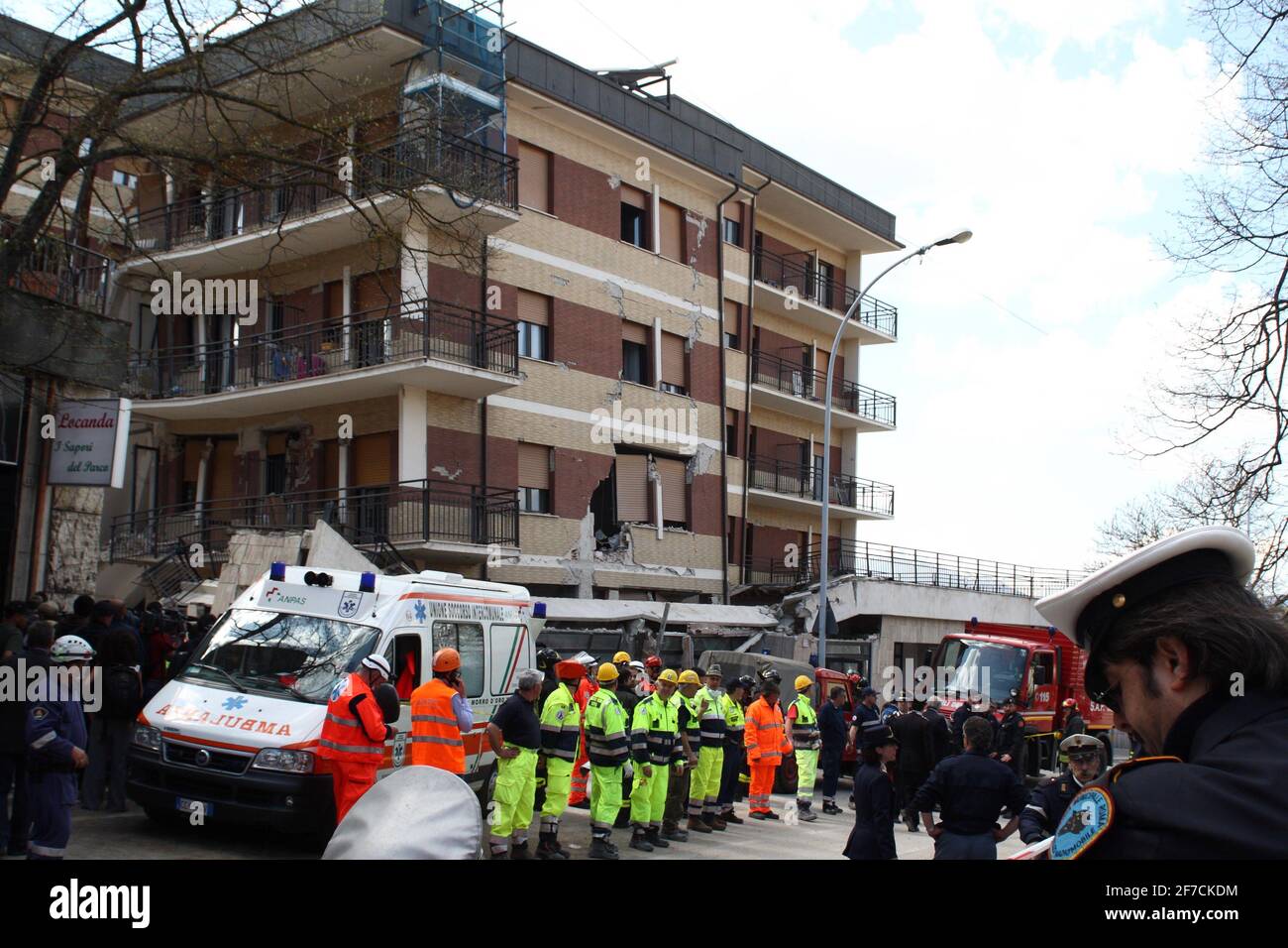 L'Aquila, Italy - April 6, 2009: The Fire Brigade in front of the student house trying to extract alive the boys trapped in the rubble Stock Photo