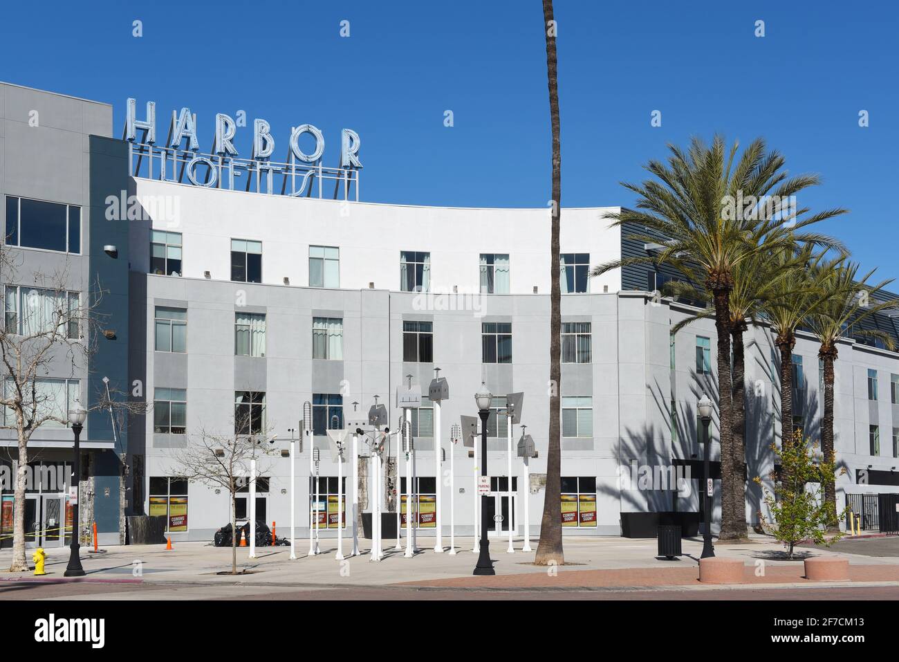 ANAHEIM, CALIFORNIA - 31 MAR 2021: Harbor Lofts sign atop the modern Condominium complex in the downtown Ctr City area. Stock Photo