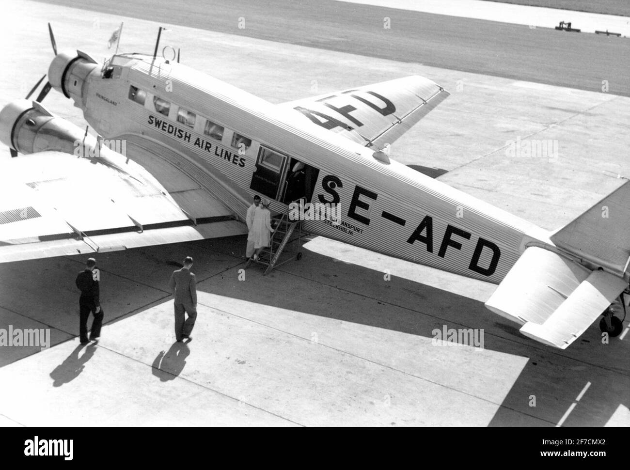 Passenger airplane Junkers Ju 52 Number SE-AFD at Bromma Airport, 1938  The company Aerotransports aircraft Junkers Ju 52 number SE-AFD from the side of Bromma airport. The image scanned from Alan Granston's album. Only digital file in FVM's ownership. Stock Photo