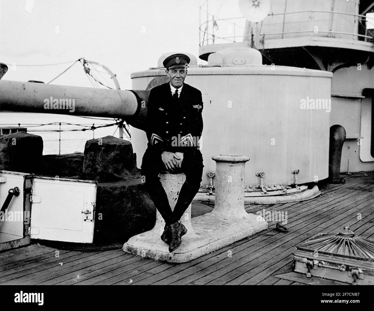 Portrait photograph of a marine officer sitting on a ship's portrait photograph of a marine