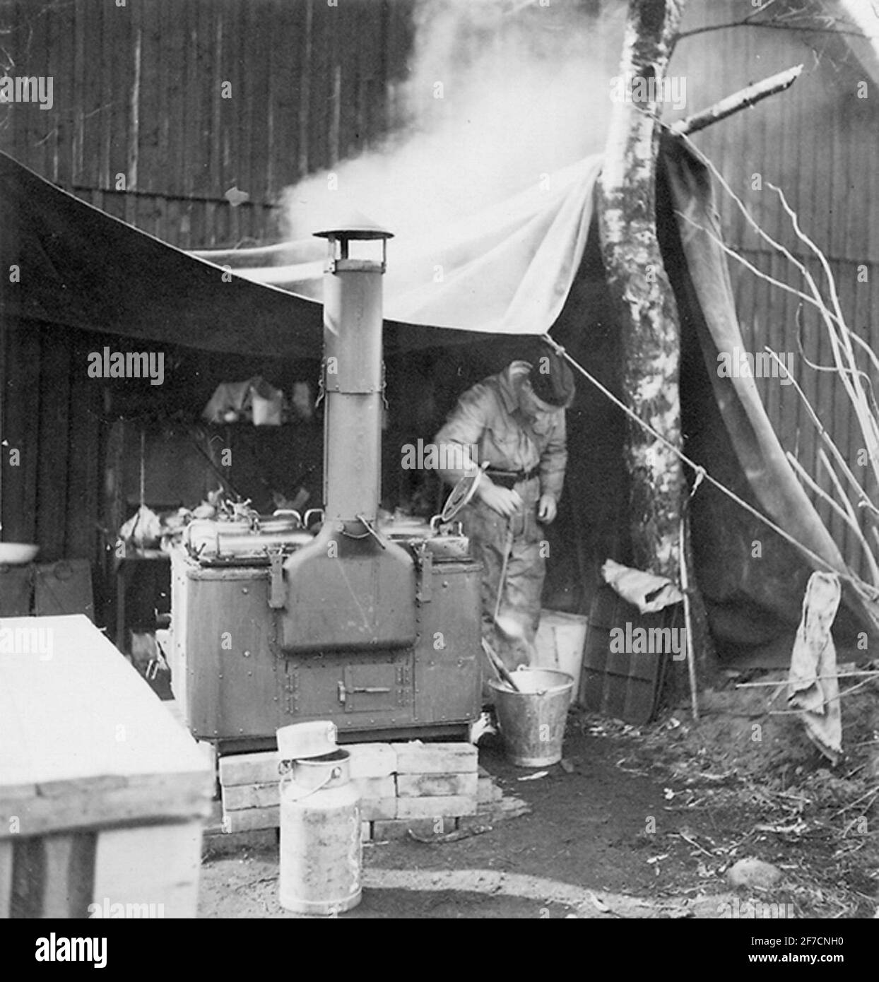 Field kitchen under maneuver, 1939 field kitchen. A soldier at the