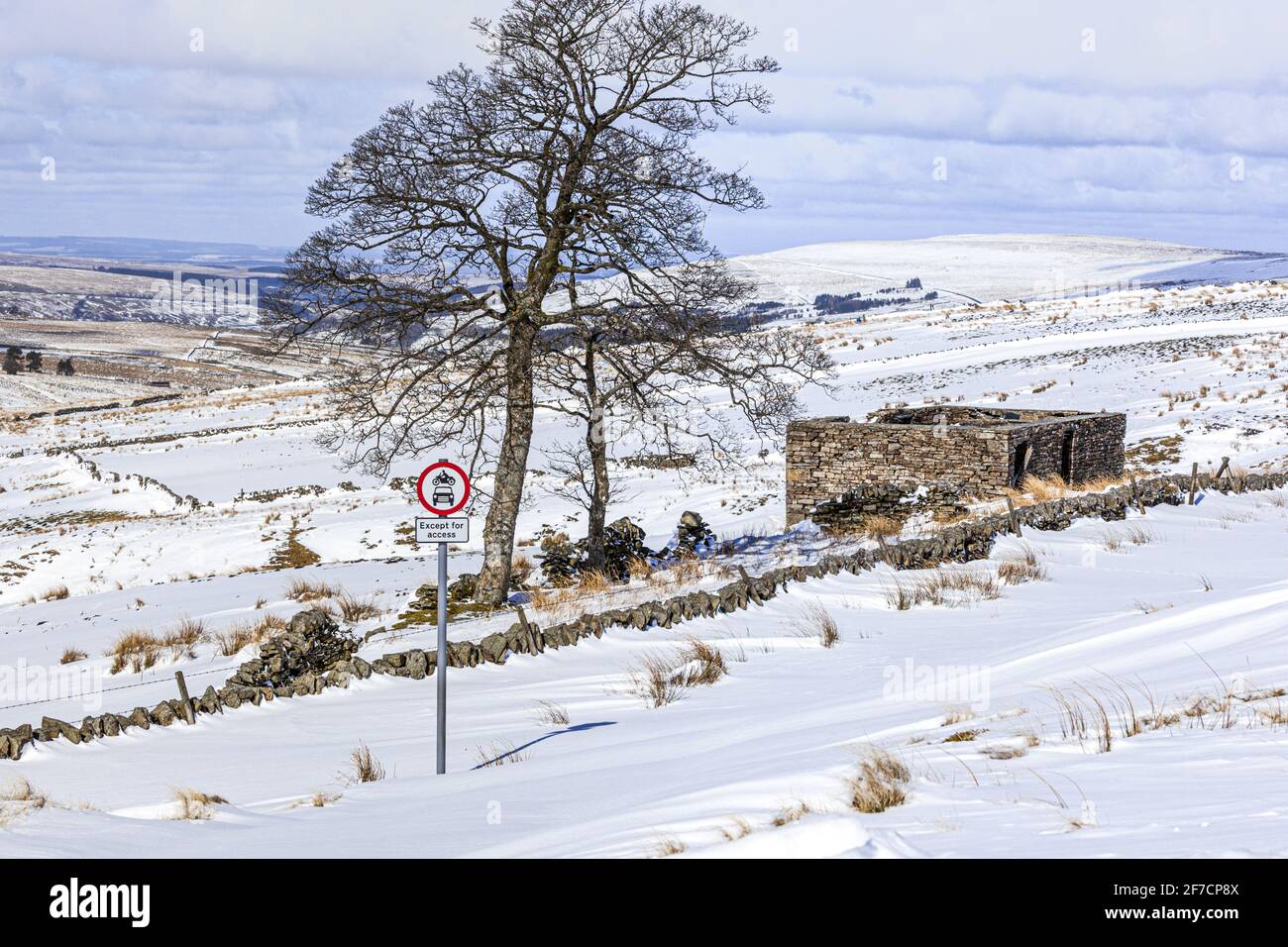 Winter in the Pennines - A lane blocked by snow near Coalcleugh, Northumberland UK Stock Photo