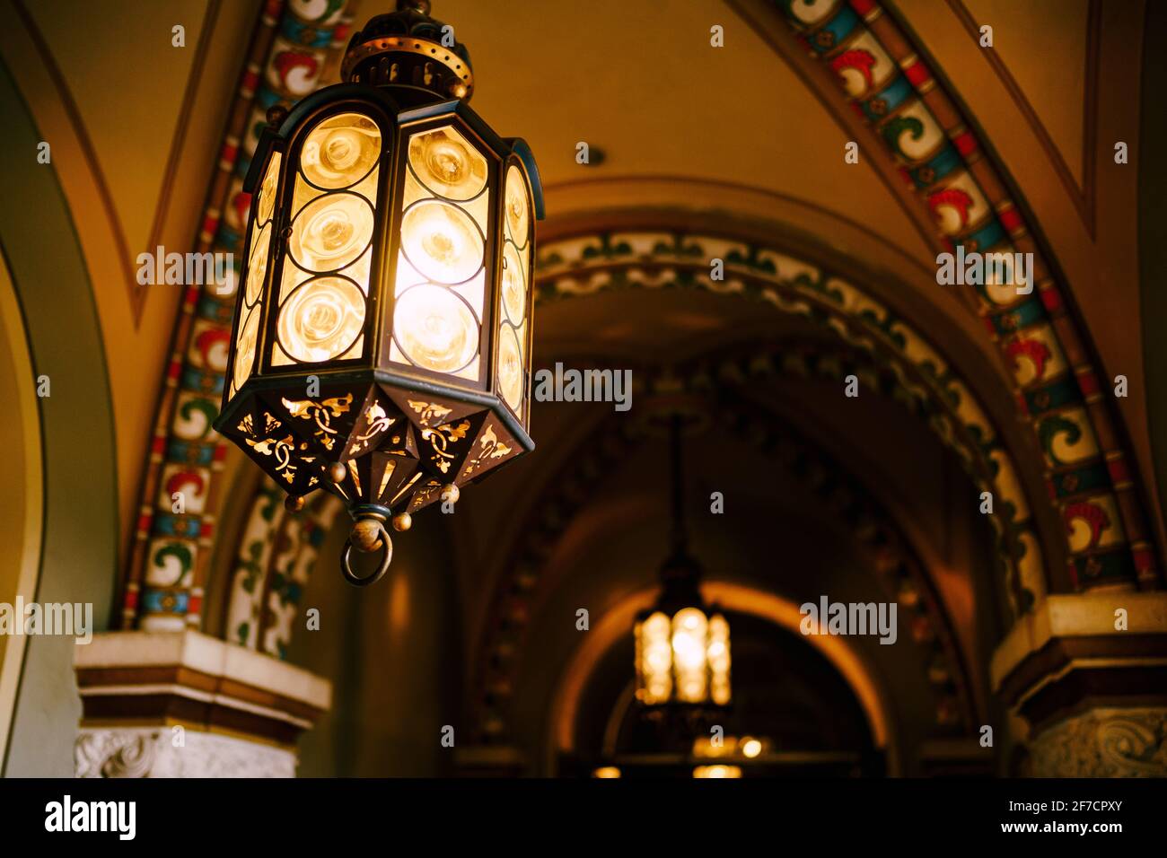 Antique German lamp on the ceiling. Octagon lantern with Fresnel lenses. Stock Photo