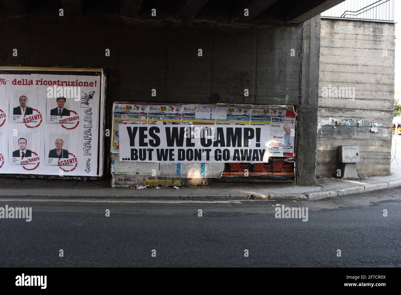 L'Aquila, Italy - July 9, 2009: The city destroyed by the earthquake and the motto 'yes we camp' Stock Photo
