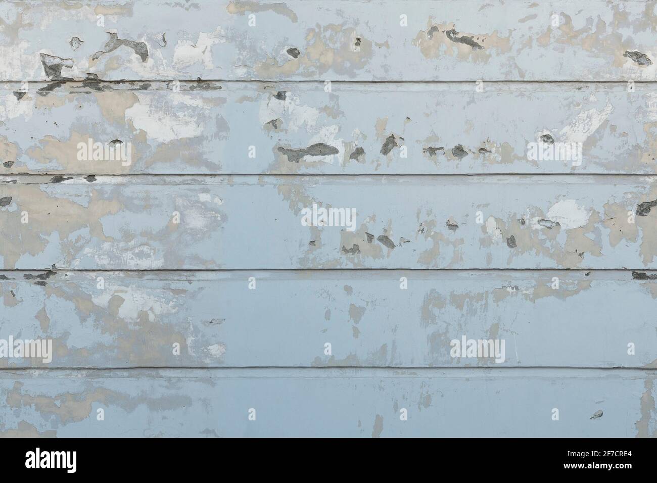 Seamless white wall with peeling plaster Stock Photo