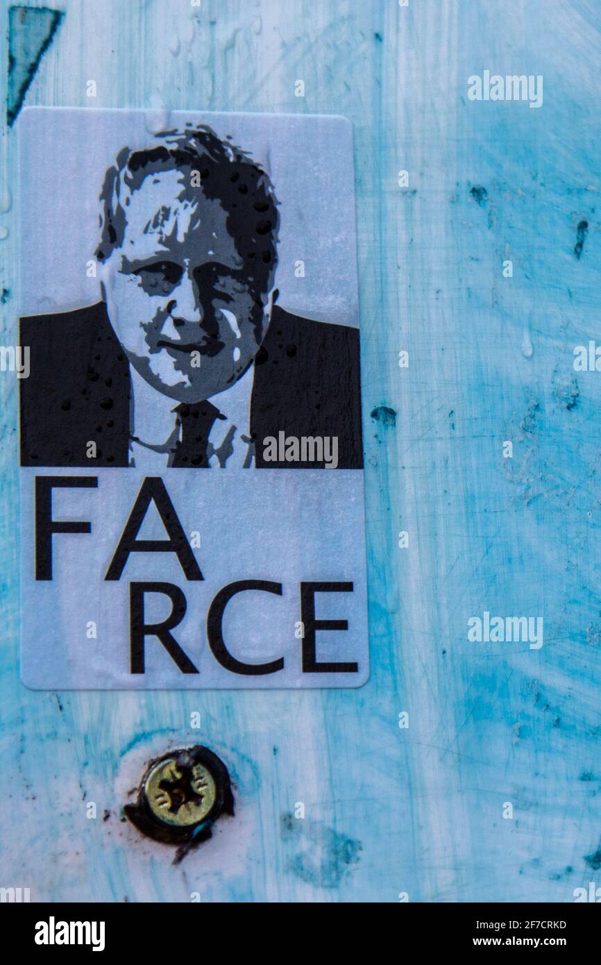 Sticker art of prime minister Boris Johnson with the text 'Farce' on a blue background.  Cambridge, UK Stock Photo
