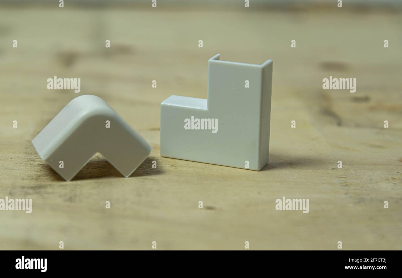 Electrical connector type elbow 90 degrees on wooden background