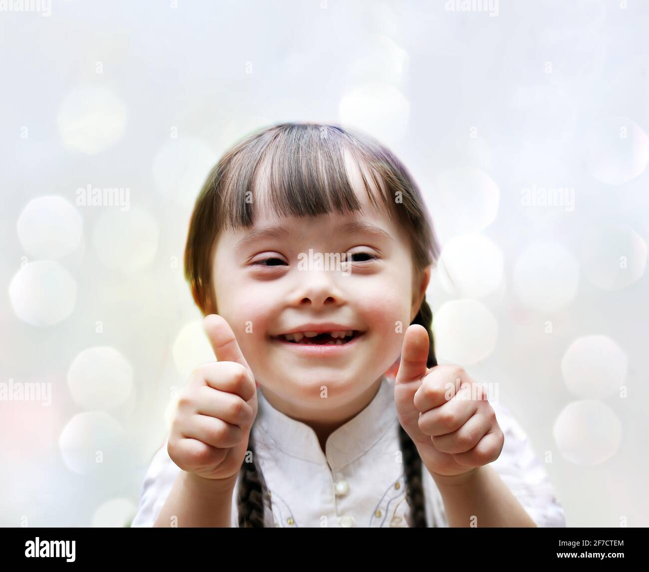 Portrait of the beautiful happy girl giving thumbs up Stock Photo - Alamy
