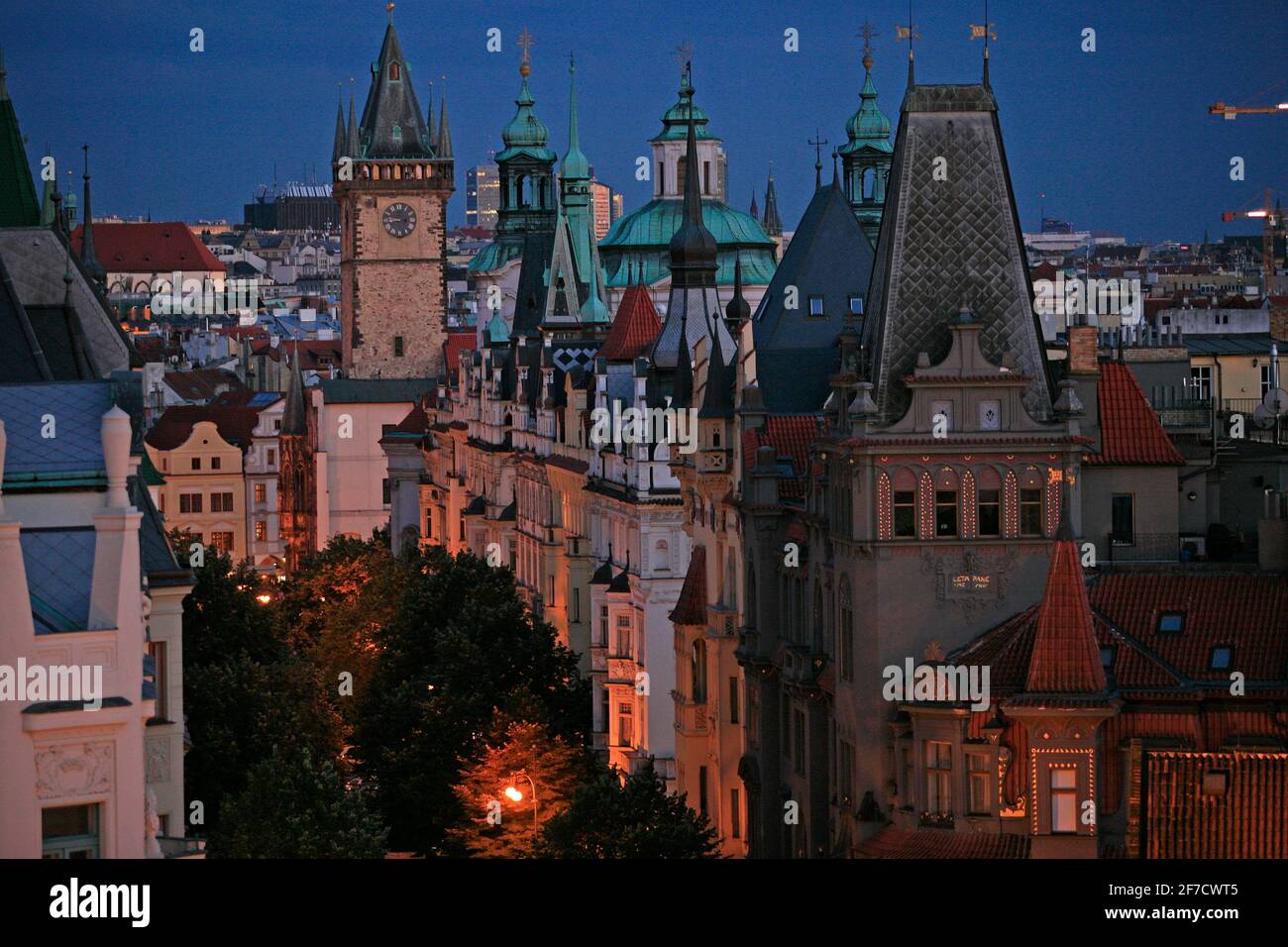 Top view of Prague's Parizska Street towards the rooftops and towers