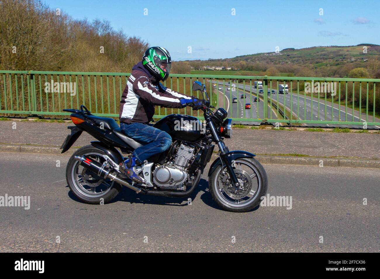 2004 Honda CBF 500-4; Motorbike rider; two wheeled transport, motorcycles,  vehicle on British roads, motorbikes, motorcycle bike riders motoring in  Manchester, UK Stock Photo - Alamy
