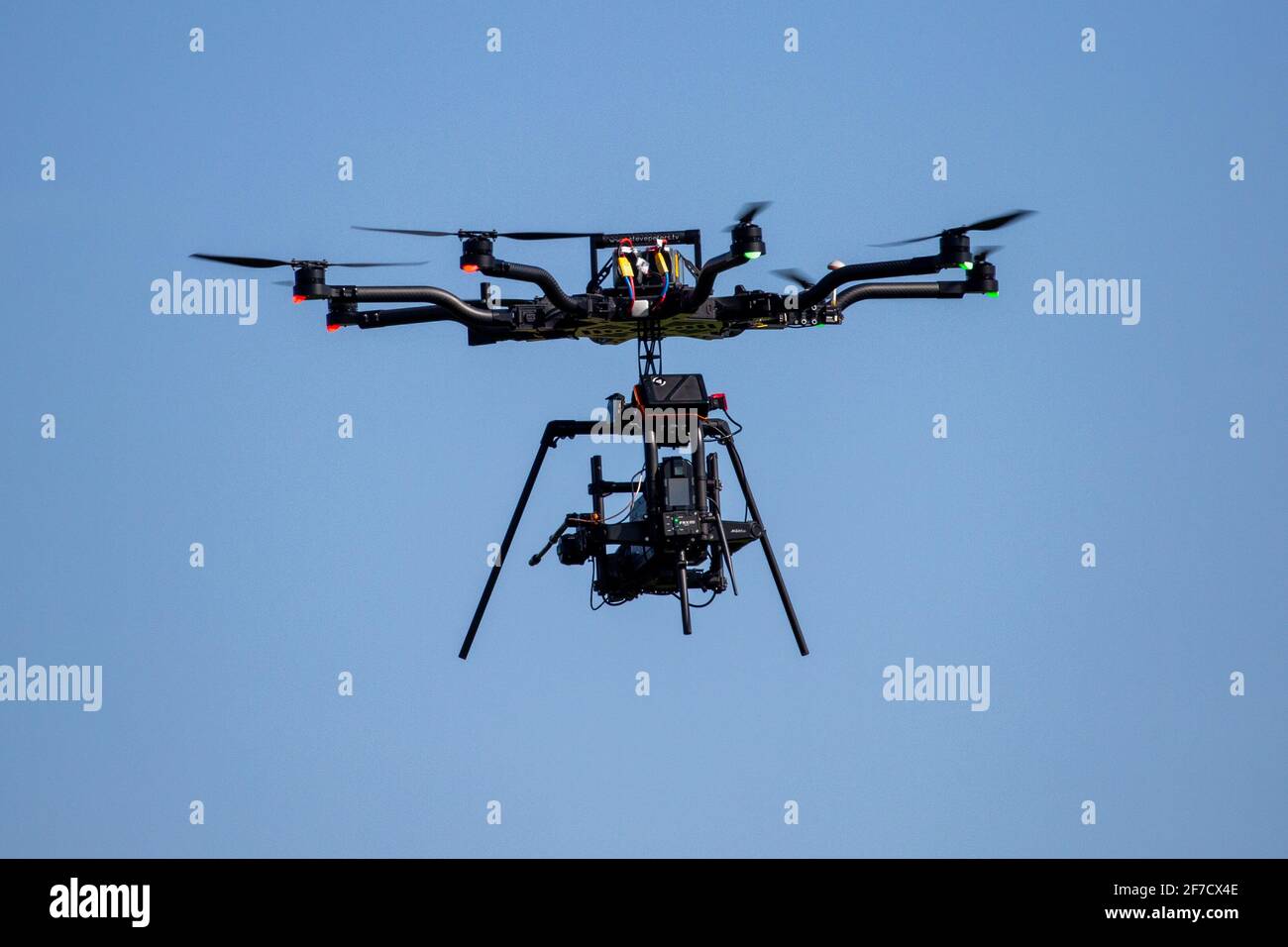 Stock picture of a Octocopter drone  (multirotor aircraft ) used to film the 2021 Boat Race on the River Great Ouse in Ely,Cambridgeshire. between Cambridge and Oxford University  The drone has 8 motors and propellers. Stock Photo