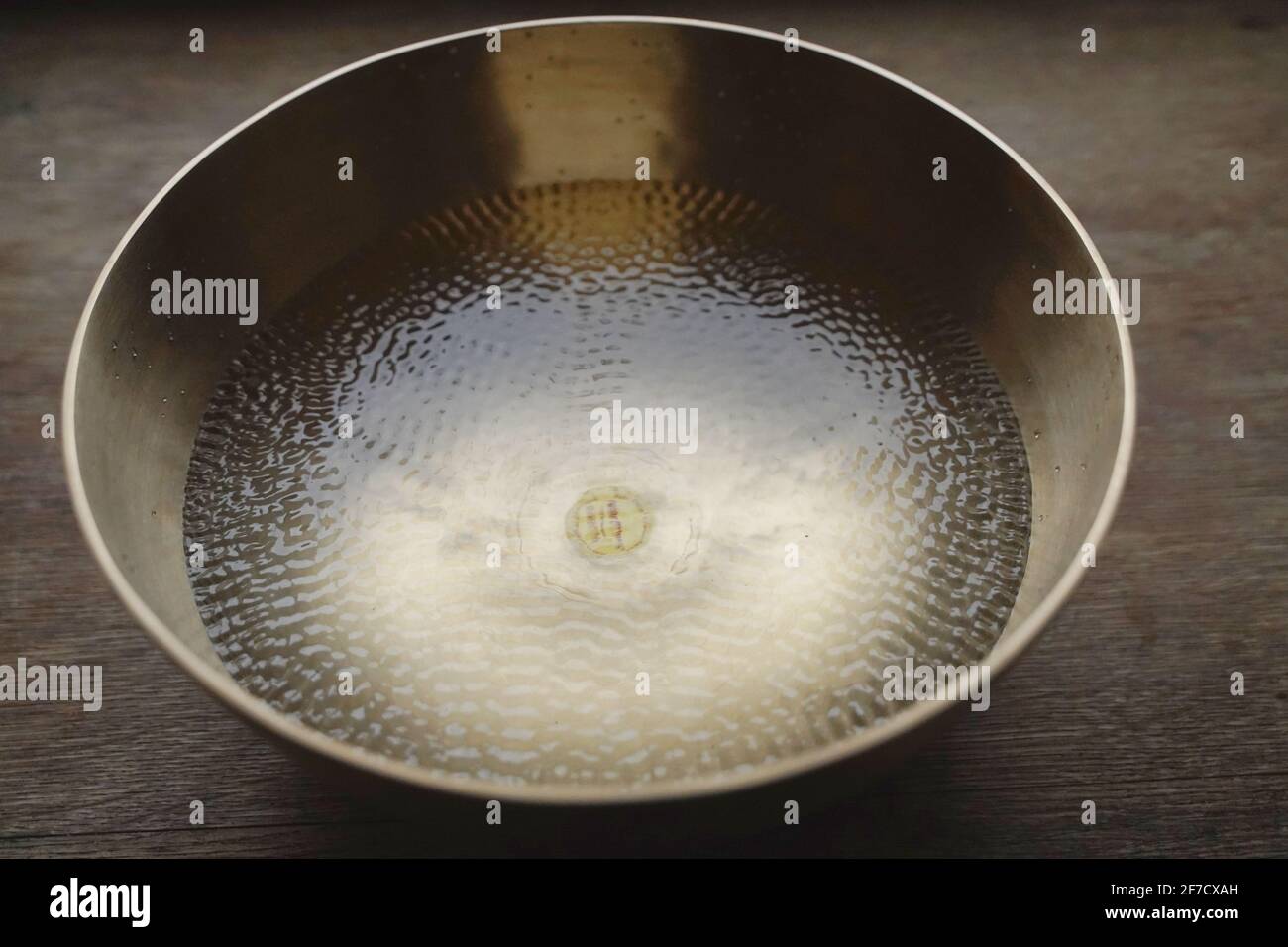 Singing bowl filled with water Stock Photo Alamy