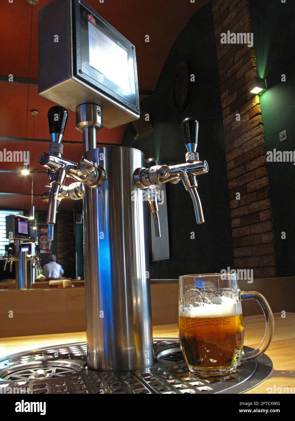 The PUB beer restaurant in the center of Prague has in one room even some  tables with self-service beer taps Stock Photo - Alamy
