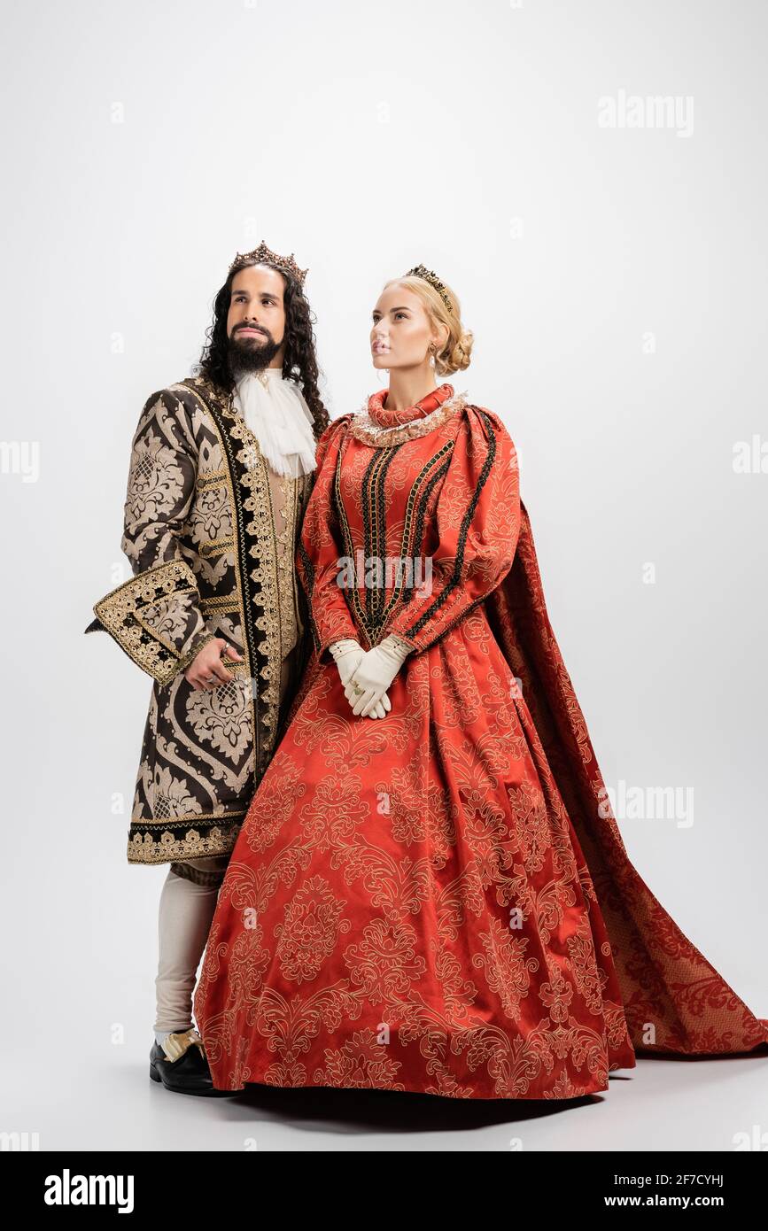 full-length-of-historical-interracial-husband-and-wife-in-crowns-and