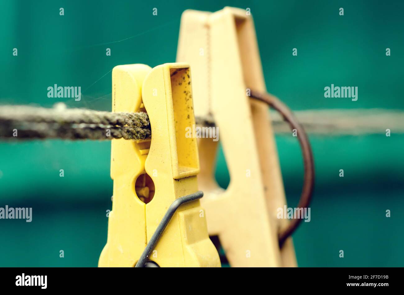 old clothespins on a rope outdoors Stock Photo