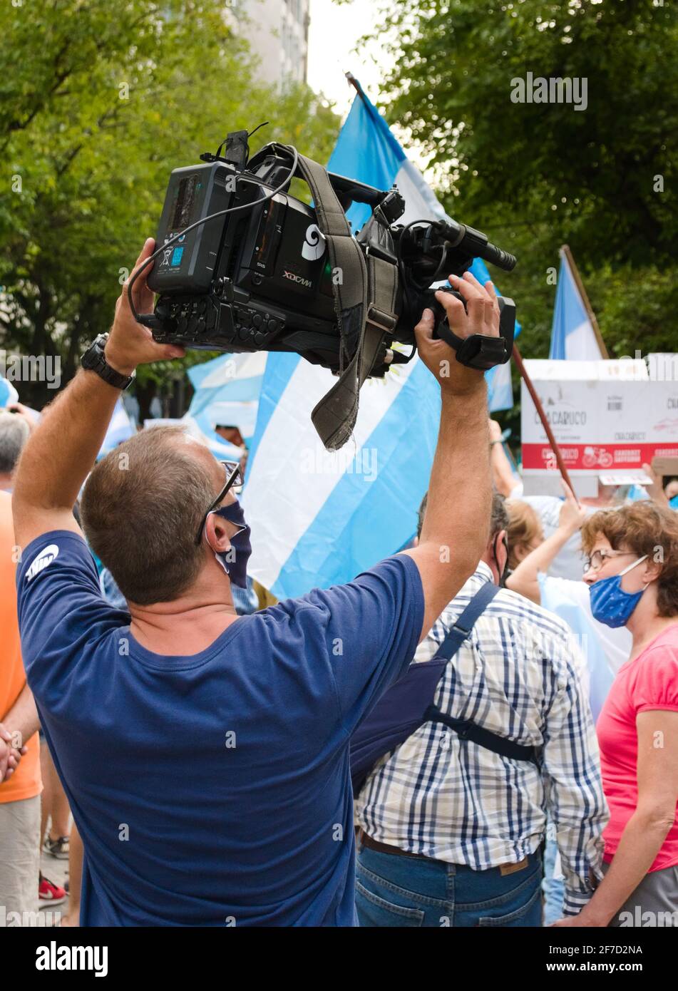 2021-02-27, Mendoza, Argentina - Cameraman holding a professional TV camera during a protest. Stock Photo