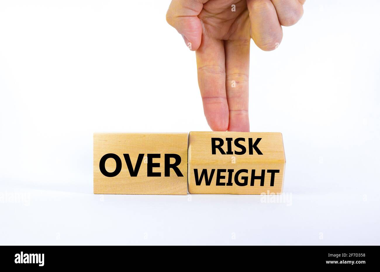 High risk from overweight symbol. Doctor turns a cube and changes the ...