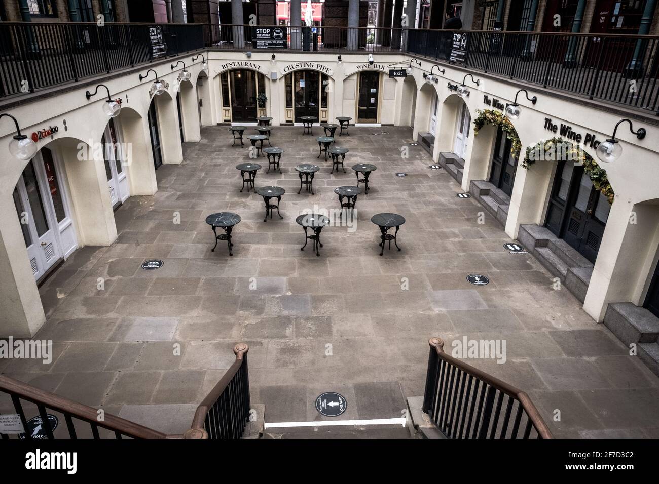 London, UK - April 2021 :  empty tables at Covent Garden Market  during the third national lockdown Stock Photo