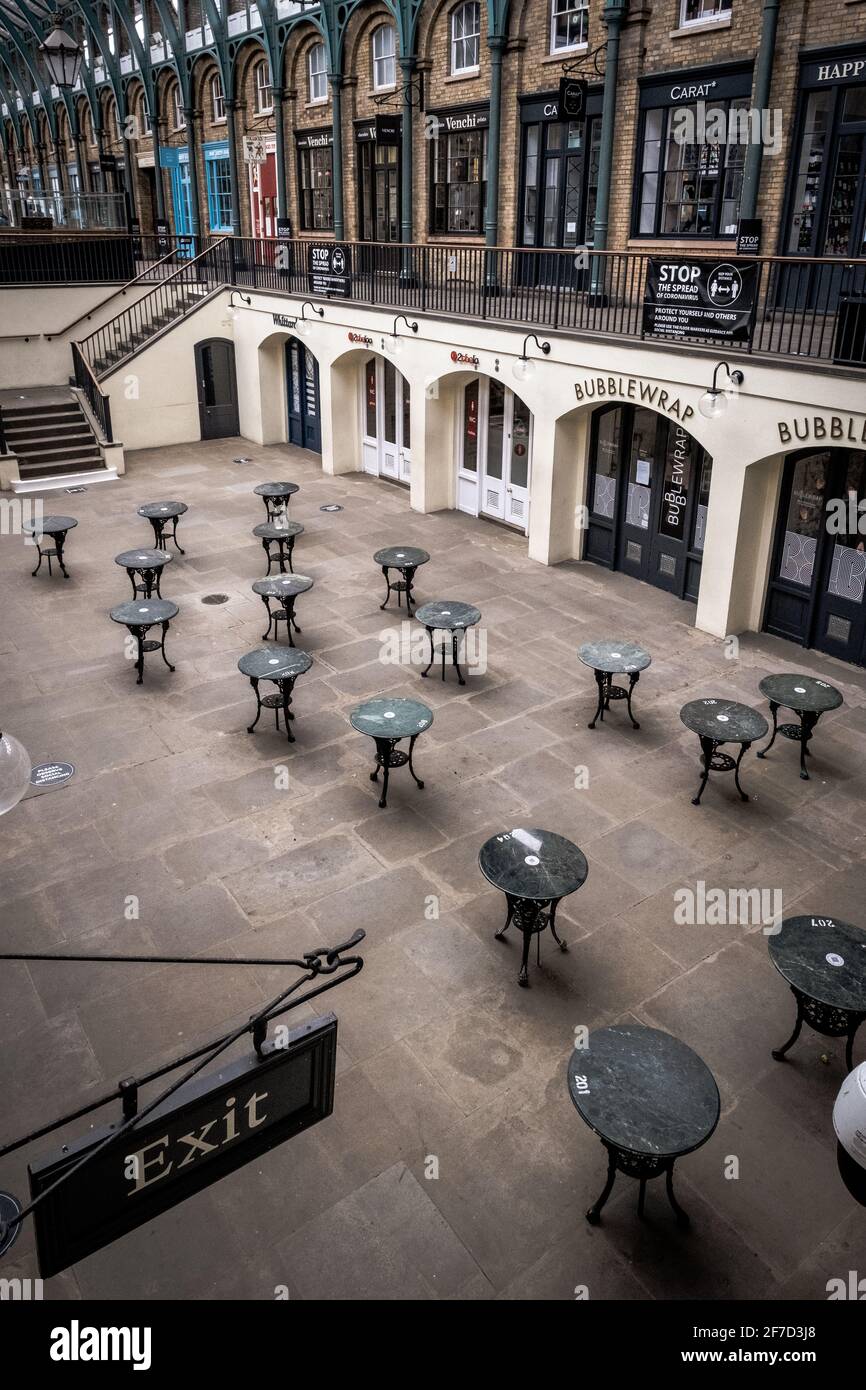 London, UK - April 2021 :  empty tables at Covent Garden Market  during the third national lockdown Stock Photo