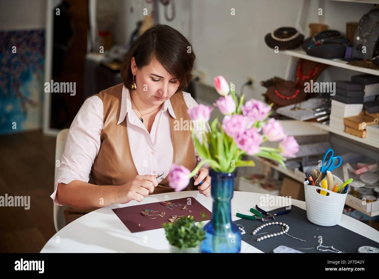 Serious professional jeweler focused on her handicraft Stock Photo Alamy