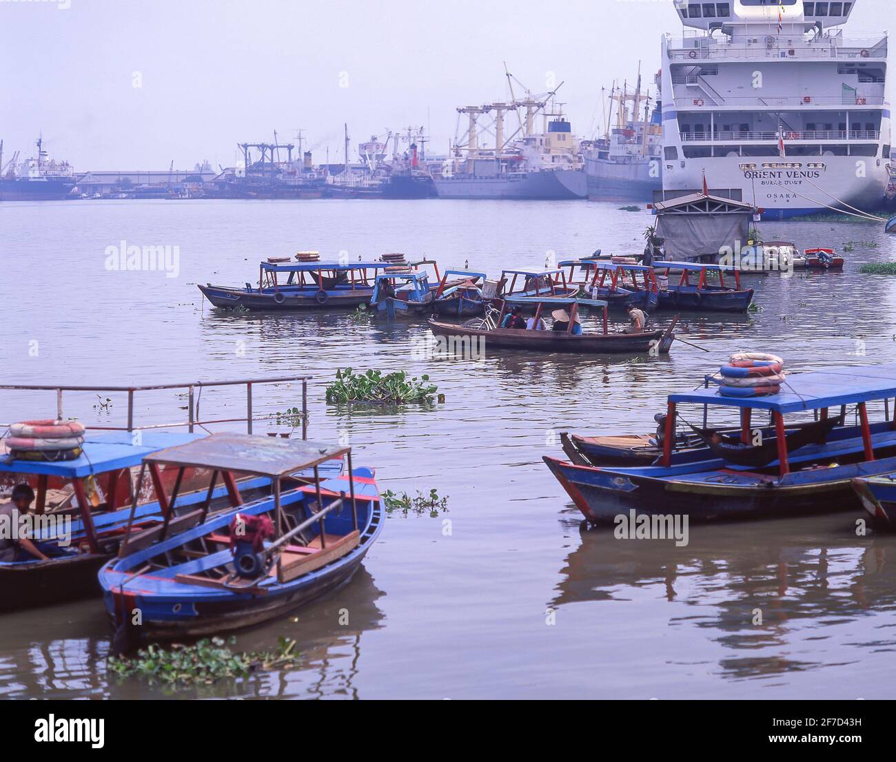 Wooden taxi boats on Saigon River, Ho Chi Minh City (Saigon), Socialist Republic of Vietnam Stock Photo