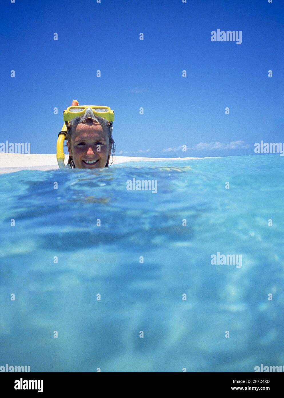 Young woman snorkeling on coral cay on Great Barrier Reef Marine Park, Queensland, Australia Stock Photo