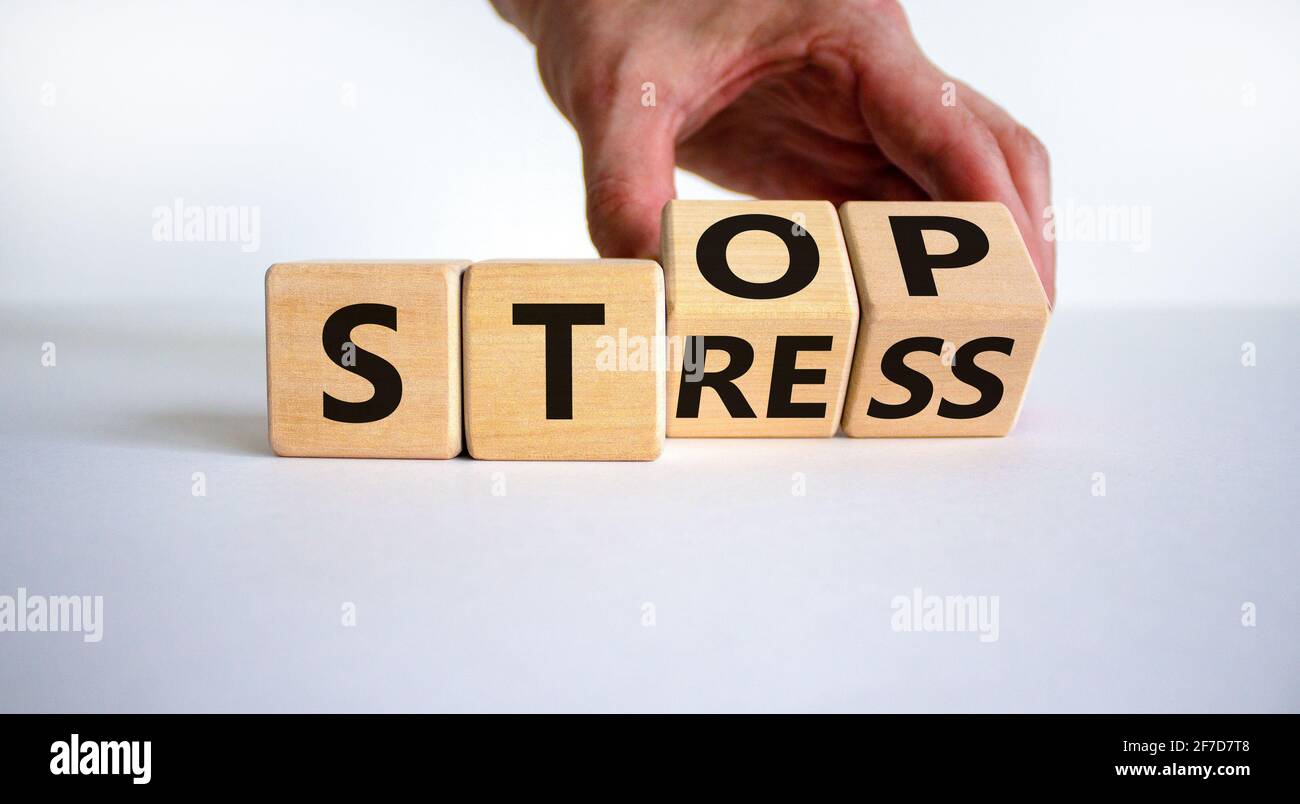 Stop stress and be health symbol. Doctor turns cubes and changes words ...