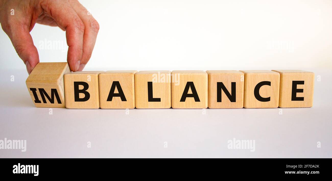 Balance or imbalance symbol. Businessman turns cubes and changes the ...